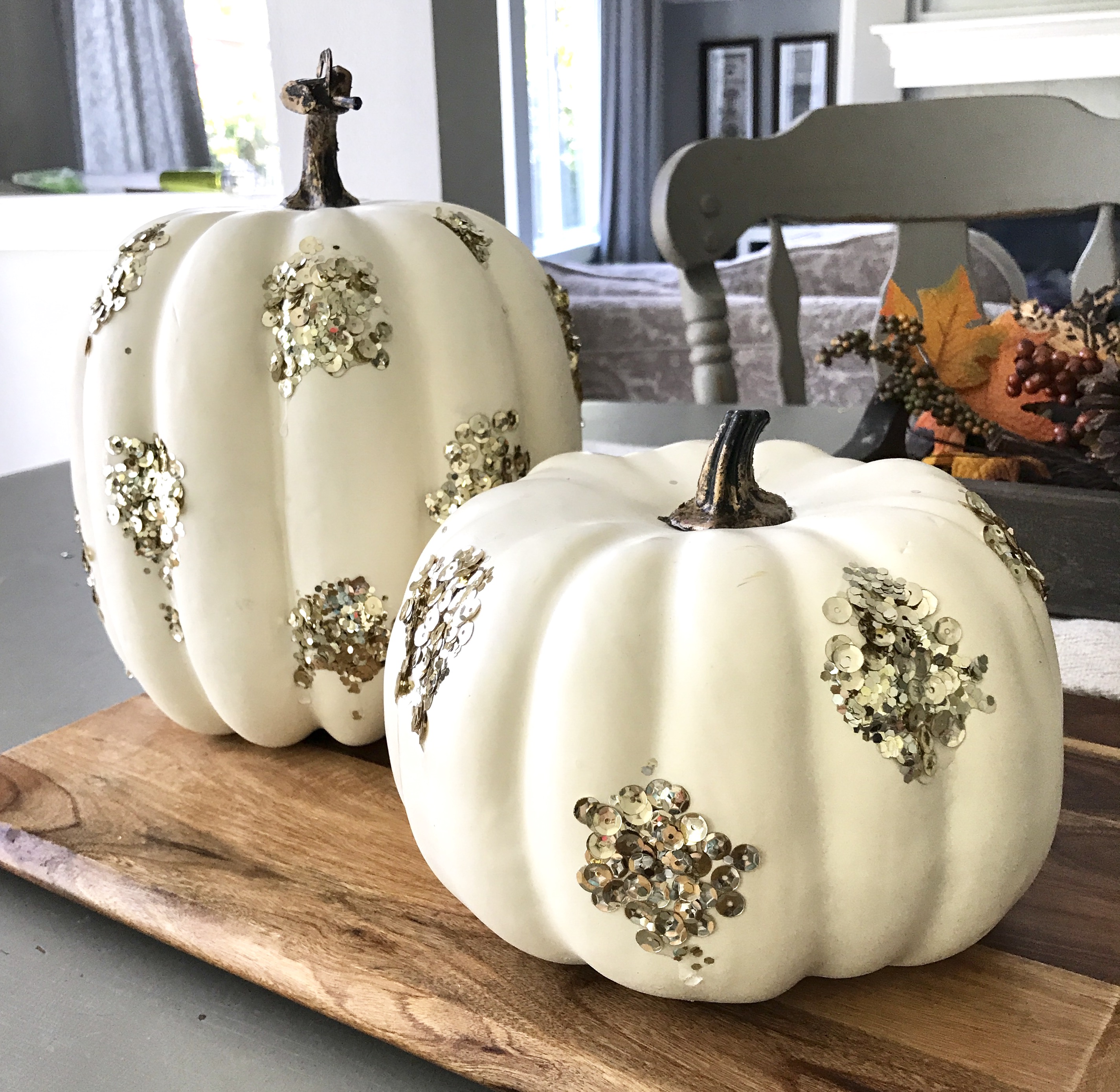 white pumpkin with gold sequins on them made by Allison Carter Celebrates