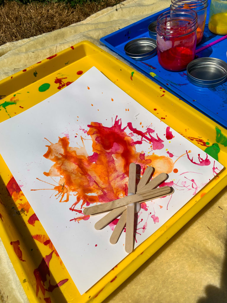 campfire painting craft - Travel blogger Nikki Harrington shares seven ideas that will turn your backyard into the ultimate (easy) family camping adventure!